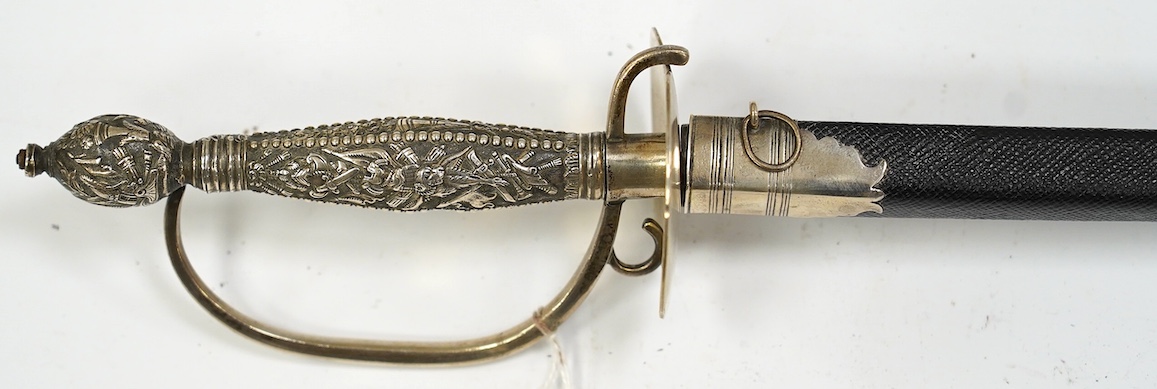 A late 18th century court sword with white metal grip, knuckle guard and mounts, decoration to scabbard band believe to be based on Admiral Duncan’s crest (Camperdown 1797), blade 84cm. Condition - fair to good, some wea